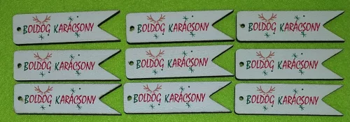  Nyomtatott ,fa alapú HDF(nem tömörfa)   Kísérő táblácska  Boldog Karácsony felirattal 	9db/csomag	7x2cm vastagság 2,5mm	