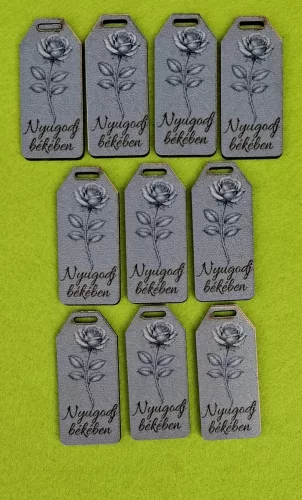Nyomtatott fa Biléta tábla márvány háttér ,rózsával Nyugodj békében felirattal 	10db/csomag	5,5x2,5cm vastagság 2,5mm	