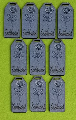 Nyomtatott fa alapú HDF(nem tömörfa) Biléta tábla márvány háttér, rózsával Emlékezünk felirattal 	10db/csomag	5,5x2,5cm vastagság 2,5mm	