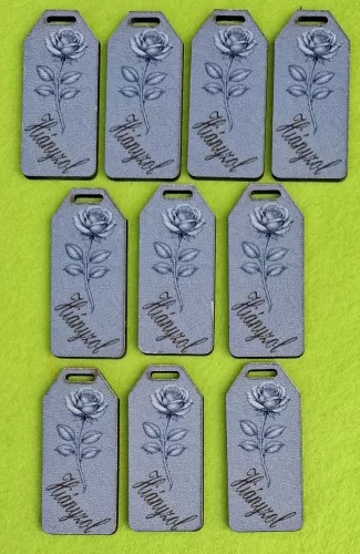 	Nyomtatott fa alapú HDF(nem tömörfa)  Biléta tábla márvány háttér ,rózsával Hiányzol felirattal 	10db/csomag	5,5x2,5cm vastagság 2,5mm	