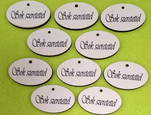 Nyomtatott ,fa alapú HDF(nem tömörfa) , Kicsi  Ovális tábla Sok szeretettel felirattal	10db/csomag	4x2,5 cm vastagság 2,5mm	