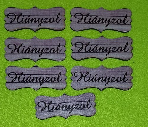   Nyomtatott  Lilás deszkás  fa biléta Hiányzol  felirattal	7db/csomag	7x3cm 