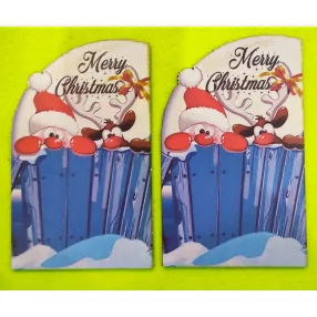   Nyomtatott fa   Télapó rudolffal kerítésen kukucskál Merry Christmas felirattal	2dbt	11x18cm, talp 13x10cm 