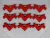  Piros színű , fa  alapú HDF(nem tömörfa)    szív galambbal 9db/csomag	6x3,5cm   