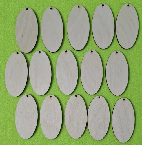 Natúr,nyír rétegelt lemez ovál tábla felül lyukkal 	15db/ csomag	8x4cm 