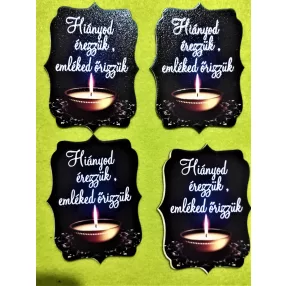   Nyomtatott fa Hiányod érezzük, emléked őrizzük   felirattal fekete háttérrel egy darab mécsessel