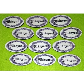   Nyomtatott fa  Kicsi  Fekete virág mintás ovális tábla Hiányzol felirattal	12db/csomag	4.5x2,5 cm 