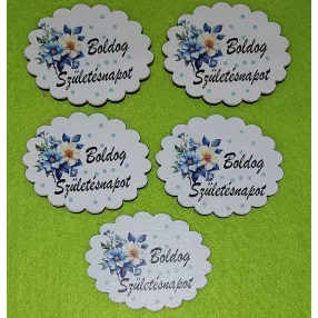    Nyomtatott fa alapú HDF(nem tömörfa) Kék virágos ovális csipkés szélü tábla Boldog születésnapot   felirattal	5db/csomag	6,5x5cm 